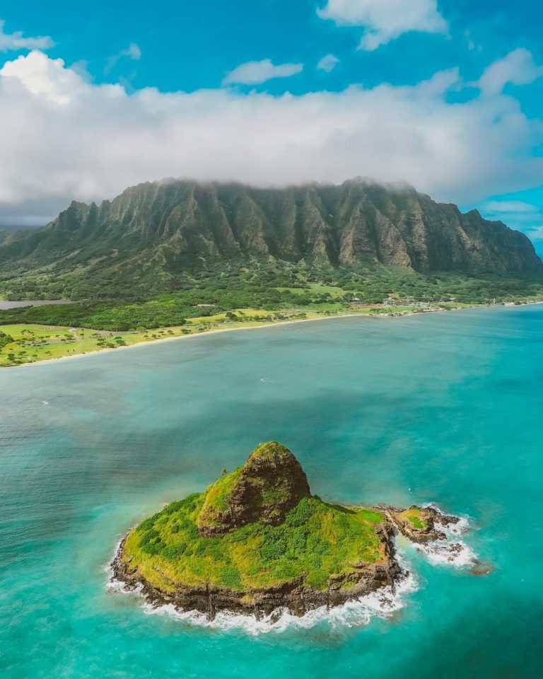 aerial photography of rocky mountains near the sea