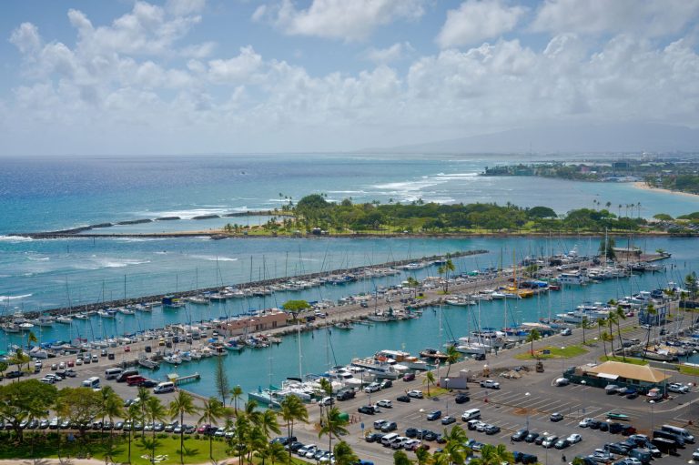 aerial view of scenic harbor with yachts and ocean